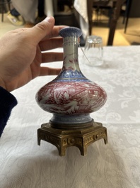 A Chinese blue-and-puce-enamelled bottle vase with a gilt bronze mount, 20th C.