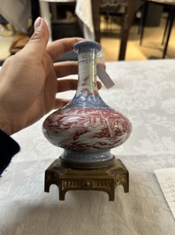 A Chinese blue-and-puce-enamelled bottle vase with a gilt bronze mount, 20th C.