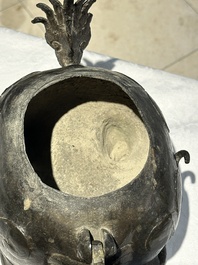 A large Chinese bronze censer and cover in the shape of a luduan, Ming