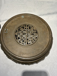 A large Chinese bronze censer and cover on stand decorated with six lions, 19th C.