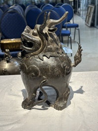 A large Chinese bronze censer and cover in the shape of a luduan, Ming