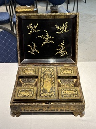 A large Chinese Canton gilt black lacquer tray, thee boxes and a fan, 19th C.