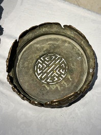 A large Chinese bronze censer and cover on stand decorated with six lions, 19th C.