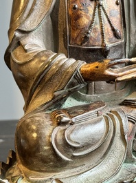 A fine Chinese partly lacquered and gilt bronze sculpture of Bodhisattva on lotus throne, Ming