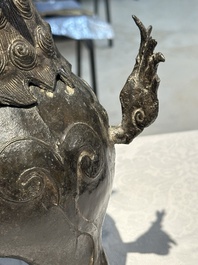 A large Chinese bronze censer and cover in the shape of a luduan, Ming