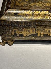 A large Chinese Canton gilt black lacquer tray, thee boxes and a fan, 19th C.