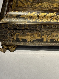 A large Chinese Canton gilt black lacquer tray, thee boxes and a fan, 19th C.