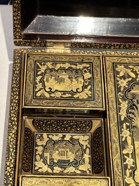 A large Chinese Canton gilt black lacquer tray, thee boxes and a fan, 19th C.