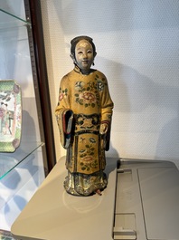 A pair of Chinese export polychrome decorated clay nodding head figures, 18/19th C.