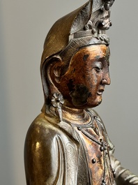 A fine Chinese partly lacquered and gilt bronze sculpture of Bodhisattva on lotus throne, Ming