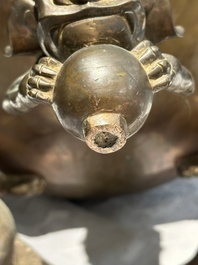 A large Chinese bronze censer and cover on stand decorated with six lions, 19th C.