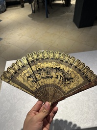 A large Chinese Canton gilt black lacquer tray, thee boxes and a fan, 19th C.