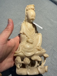 A Chinese soapstone and a crystal figures of Guanyin and a jade 'chilong' plaque, 19th C.