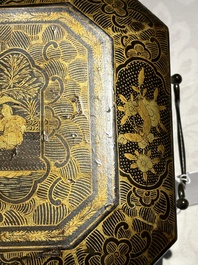 A large Chinese Canton gilt black lacquer tray, thee boxes and a fan, 19th C.