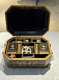 A large Chinese Canton gilt black lacquer tray, thee boxes and a fan, 19th C.