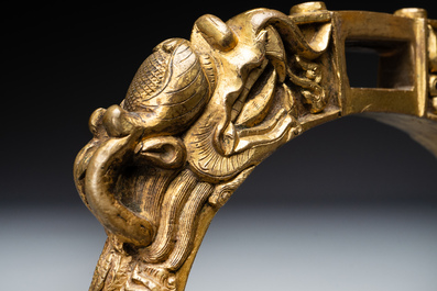 A pair of Chinese imperial gilt-bronze stirrups with dragons, De 德 mark, 18th C.