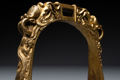 A pair of Chinese imperial gilt-bronze stirrups with dragons, De 德 mark, 18th C.