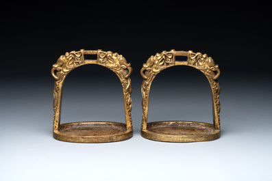 A pair of Chinese imperial gilt-bronze stirrups with dragons, De 德 mark, 18th C.