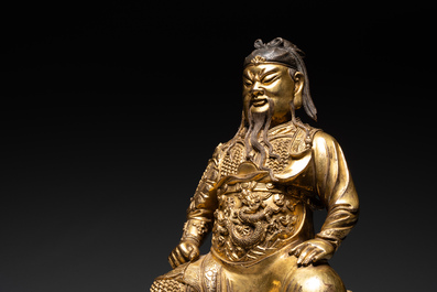 An extremely rare Chinese gilt bronze figure of Guandi, Ming