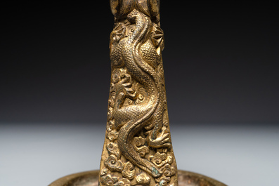 A pair of Chinese imperial gilt-bronze stirrups with dragons, De 德 mark, 18th C.