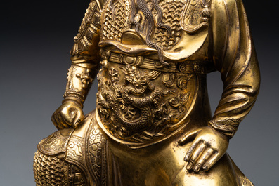 An extremely rare Chinese gilt bronze figure of Guandi, Ming