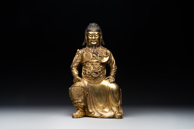 An extremely rare Chinese gilt bronze figure of Guandi, Ming
