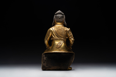 An extremely rare Chinese gilt bronze figure of Guandi, Ming