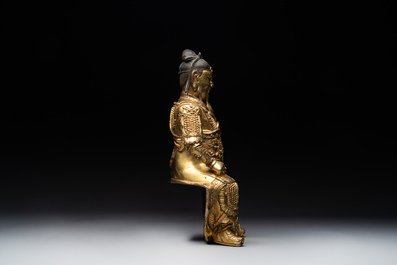 An extremely rare Chinese gilt bronze figure of Guandi, Ming