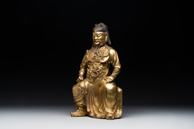 An extremely rare Chinese gilt bronze figure of Guandi, Ming