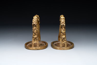 A pair of Chinese imperial gilt-bronze stirrups with dragons, De 德 mark, 18th C.