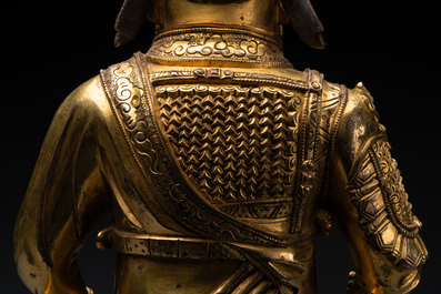 An extremely rare Chinese gilt bronze figure of Guandi, Ming
