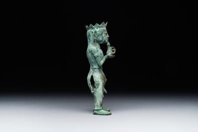 An fine Indonesian bronze sculpture of a naked man offering a sacrificial vase, Majapahit, East Java, 13/14th C.