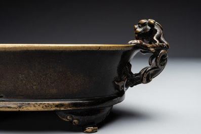 A rare Chinese bronze narcissus basin-shaped censer with dragon handles, Xuande mark, 17th C.