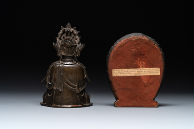 A Chinese bronze Guanyin, Ming and a Tibetan polychrome plaster relief, 19th C.