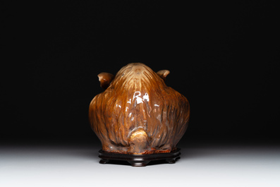 A fine Chinese cafe-au-lait glazed hare on wooden stand, Tian 天 mark, Qing
