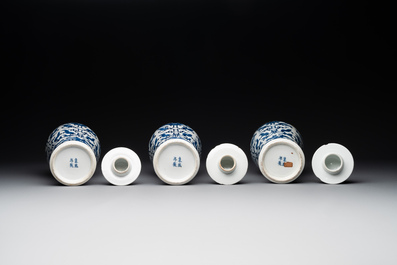 A Chinese blue and white garniture of five vases with lotus scrolls, 19th C.