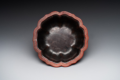 A Chinese red cinnabar lacquer jardiniere with floral design, Yongzheng/Qianlong