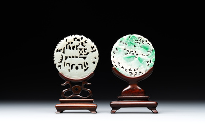 Two Chinese round jade plaques on carved wooden stands, 19th C.