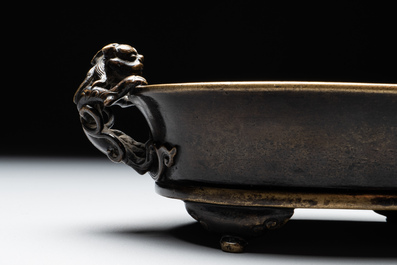 A rare Chinese bronze narcissus basin-shaped censer with dragon handles, Xuande mark, 17th C.