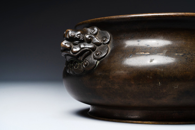 A Chinese bronze censer with lion handles, Xuande mark, 17/18th C.