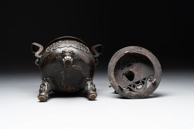 A large Chinese bronze censer and cover with a Buddhist lion, Ming