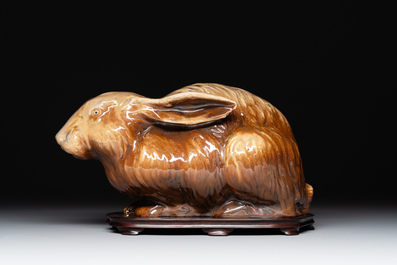 A fine Chinese cafe-au-lait glazed hare on wooden stand, Tian 天 mark, Qing