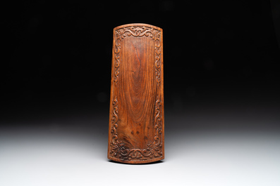 A Chinese Huanghuali wood coffin-shaped offering box and cover with mountainous landscape design, 17/18th C.