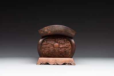A Chinese Huanghuali wood coffin-shaped offering box and cover with mountainous landscape design, 17/18th C.