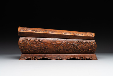 A Chinese Huanghuali wood coffin-shaped offering box and cover with mountainous landscape design, 17/18th C.