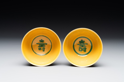 A pair of Chinese yellow-ground 'dragon' and 'shou' bowls, Guangxu mark and of the period