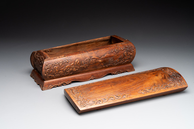 A Chinese Huanghuali wood coffin-shaped offering box and cover with mountainous landscape design, 17/18th C.