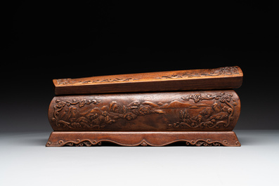 A Chinese Huanghuali wood coffin-shaped offering box and cover with mountainous landscape design, 17/18th C.