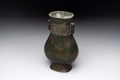 A Chinese silver-inlaid bronze arrow vase with Taotie design, 'touhu 投壺', Ming