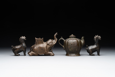 A pair of Chinese bronze mythical creatures and two ewers, Ming